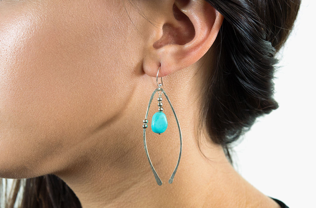 Model wearing Metal & Stone. Artisan arches earrings Copper/silver earwires All sterling silver earwires