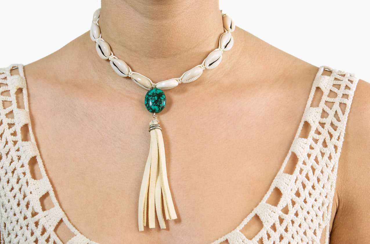 Model wearing Turquoise & Tassel. Shell and leather necklace
