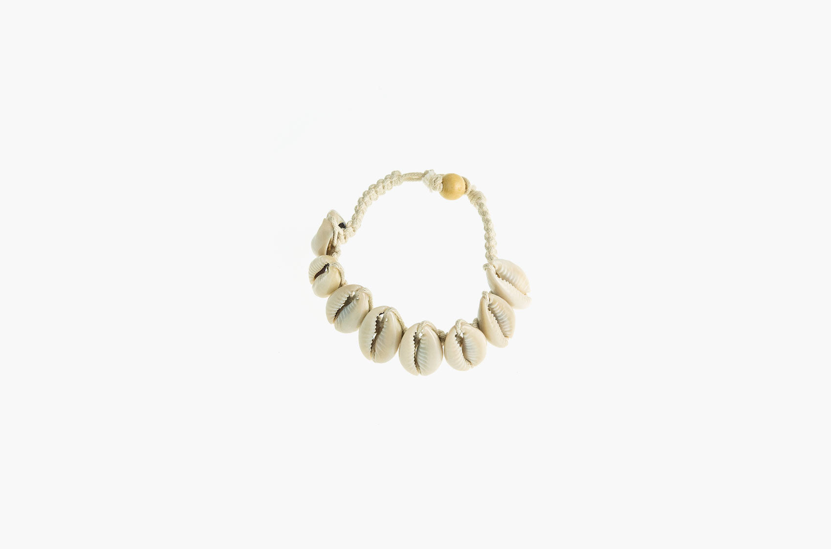 Conch shell and white woven cotton bracelets