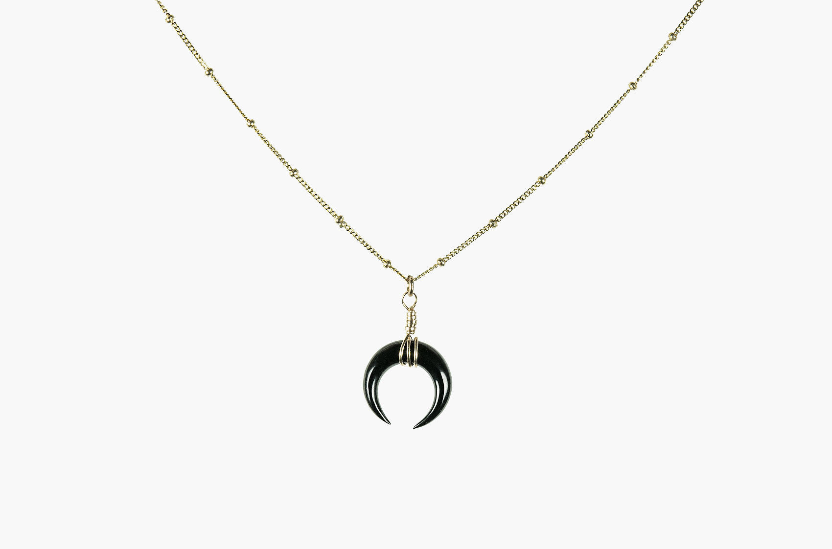 Little Big Horn. Mini crescent necklace black with gold