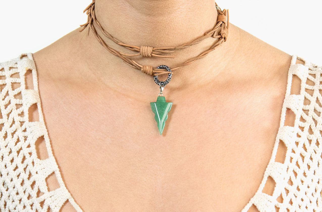 Model wearing Barbed leather wrap necklace with jade arrow pendant