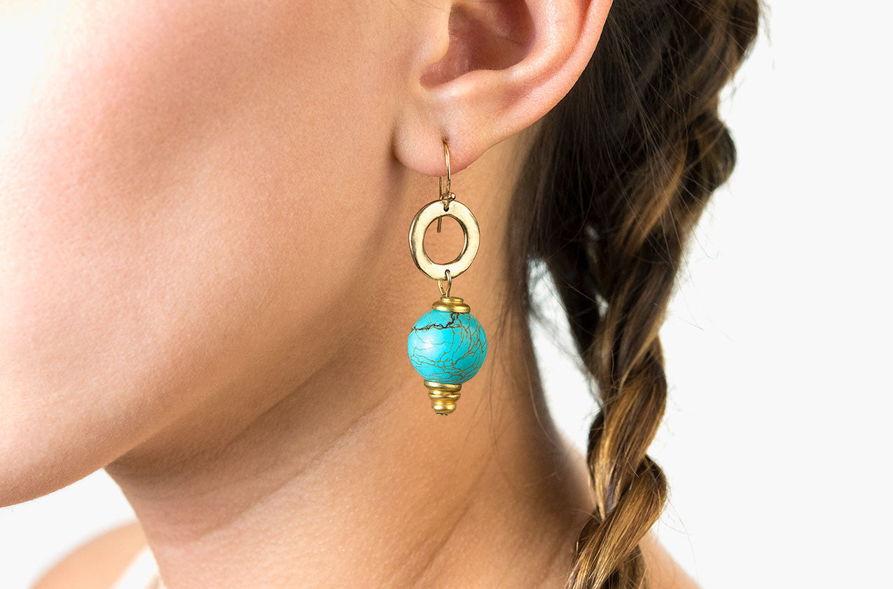 Model wearing Metal & Stone. Petite turquoise earrings