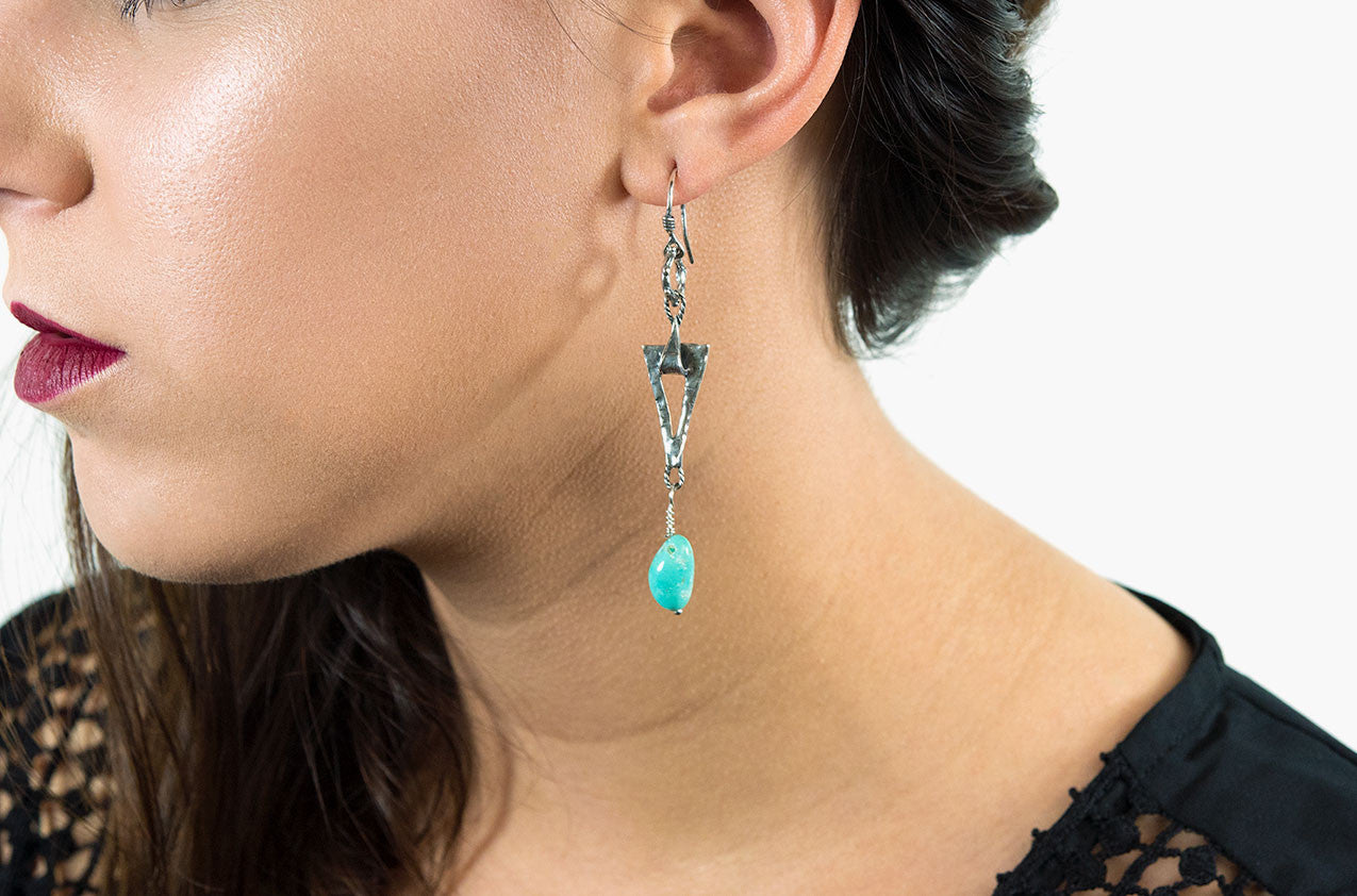 Model wearing Silver & Stone. Artisan triangle earrings