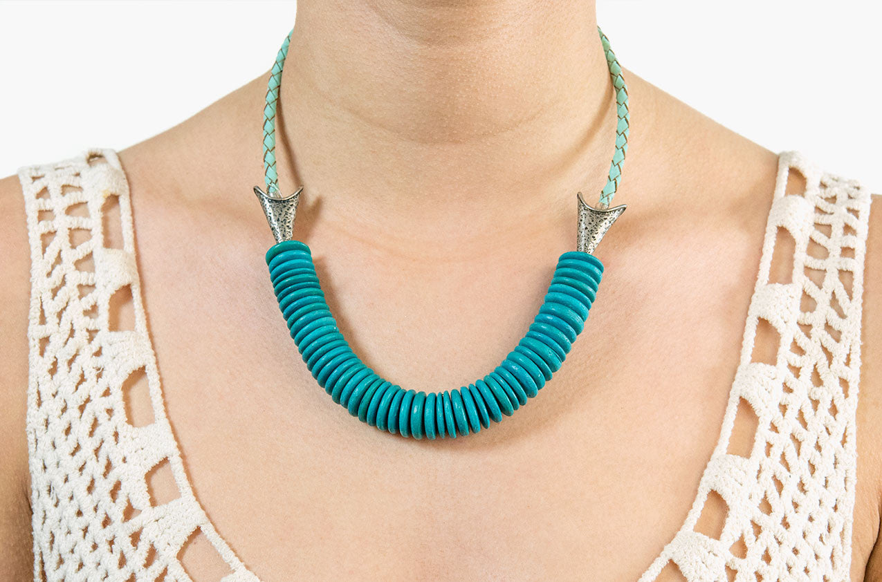 Model wearing Leather and turquoise wood arrow necklace