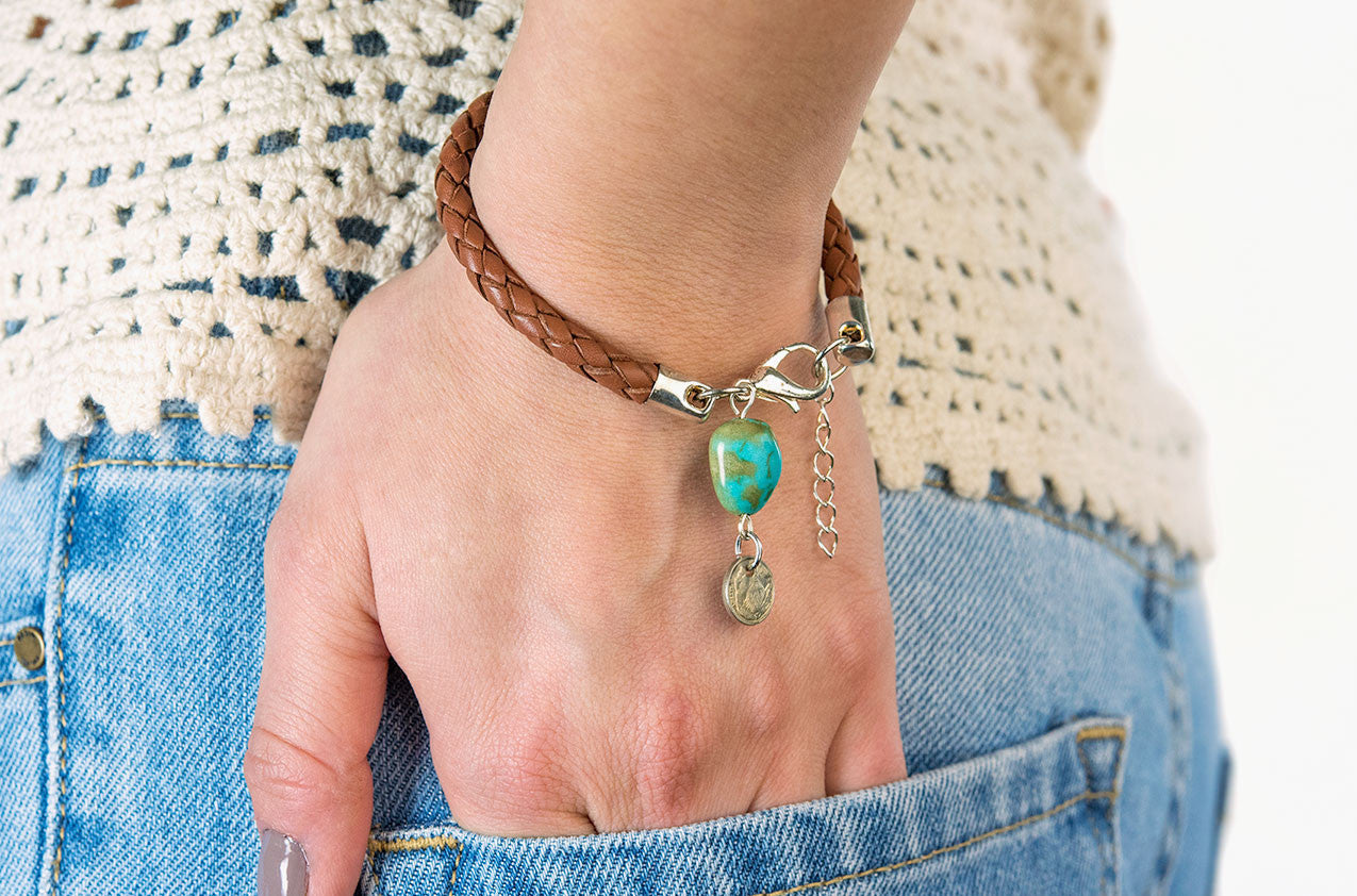 Model wearing Plaited leather and turquoise bracelet