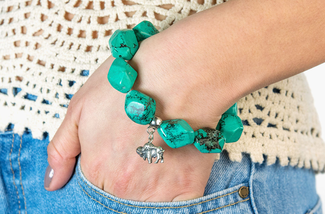 Model wearing Serious Rocks. Super-size turquoise chunks bracelet