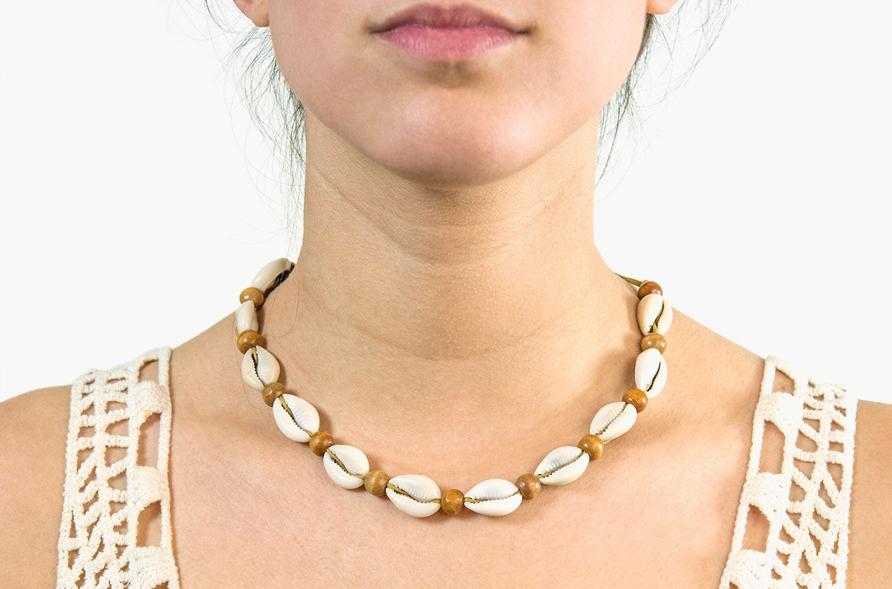 Model wearing Shell and wood necklace
