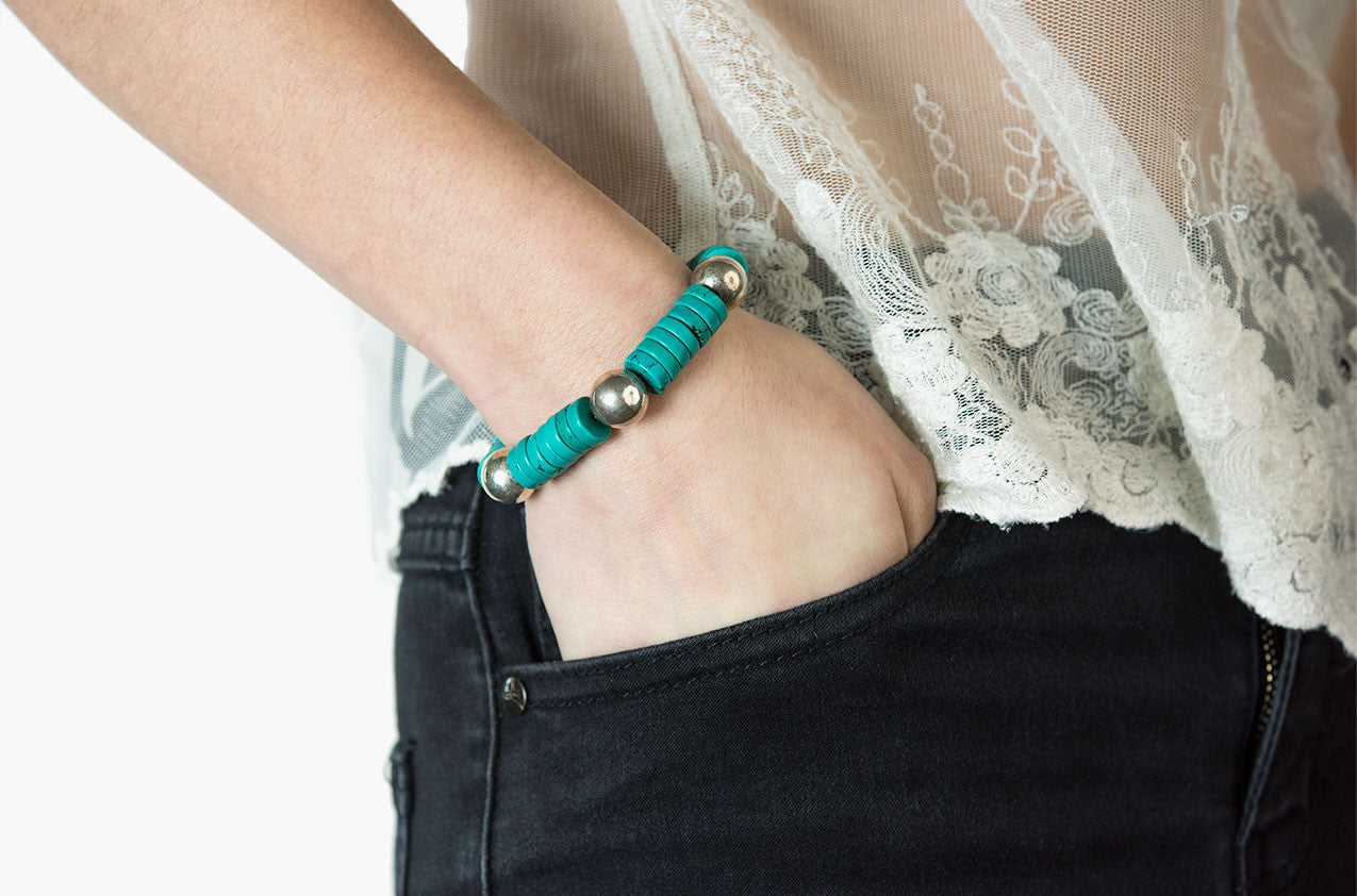 Model wearing Silver & Stone. Turquoise and silver bracelet