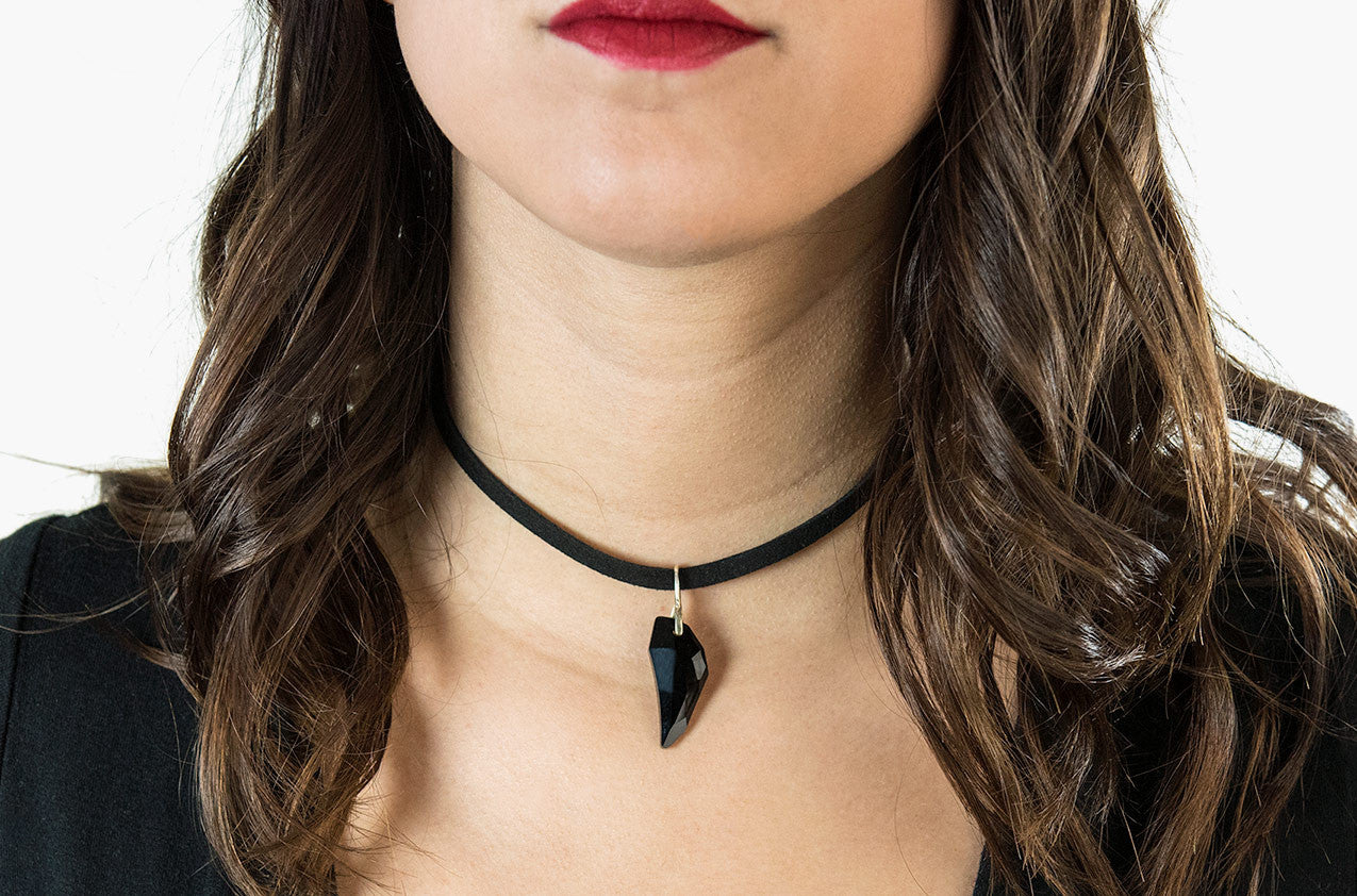 Model wearing Swarovski Wolf Tooth leather choker black with sterling silver
