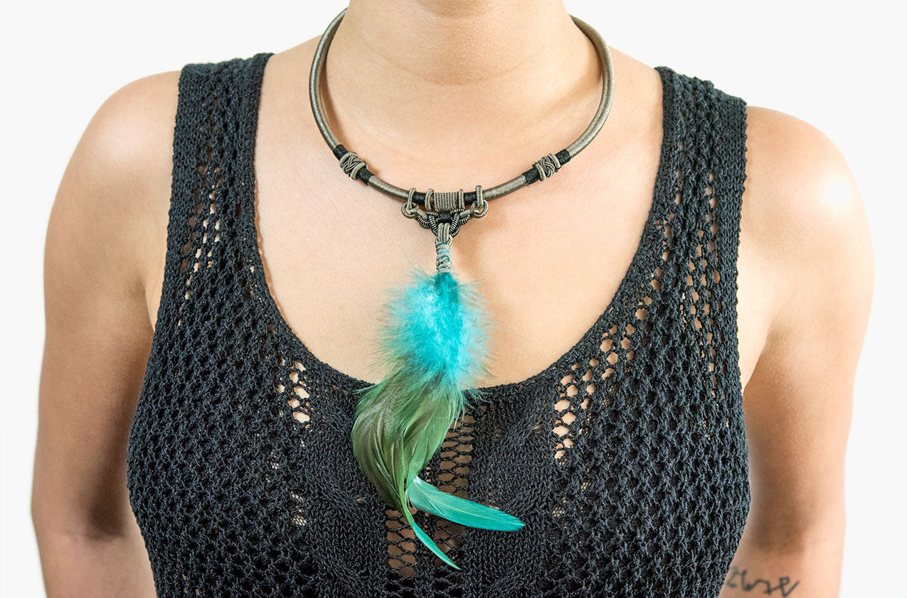 Model wearing Tribal woven necklace with azure feather