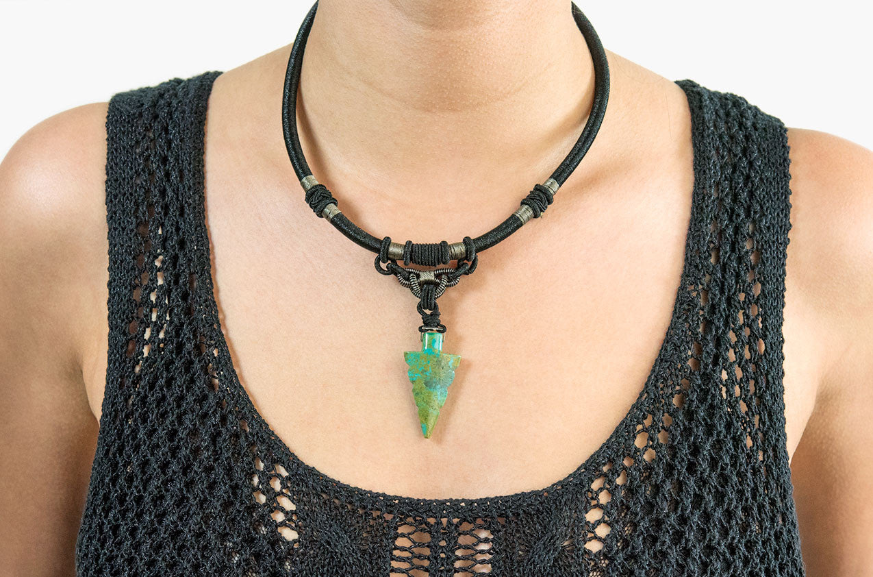 Model wearing Tribal woven necklace with jade arrow pendant