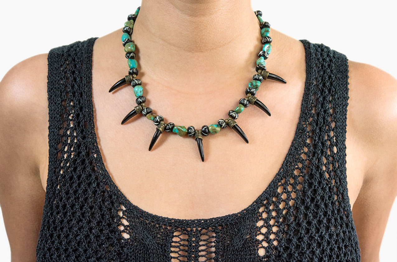 Model wearing Turquoise and Teeth. Fierce tribal necklace with bone