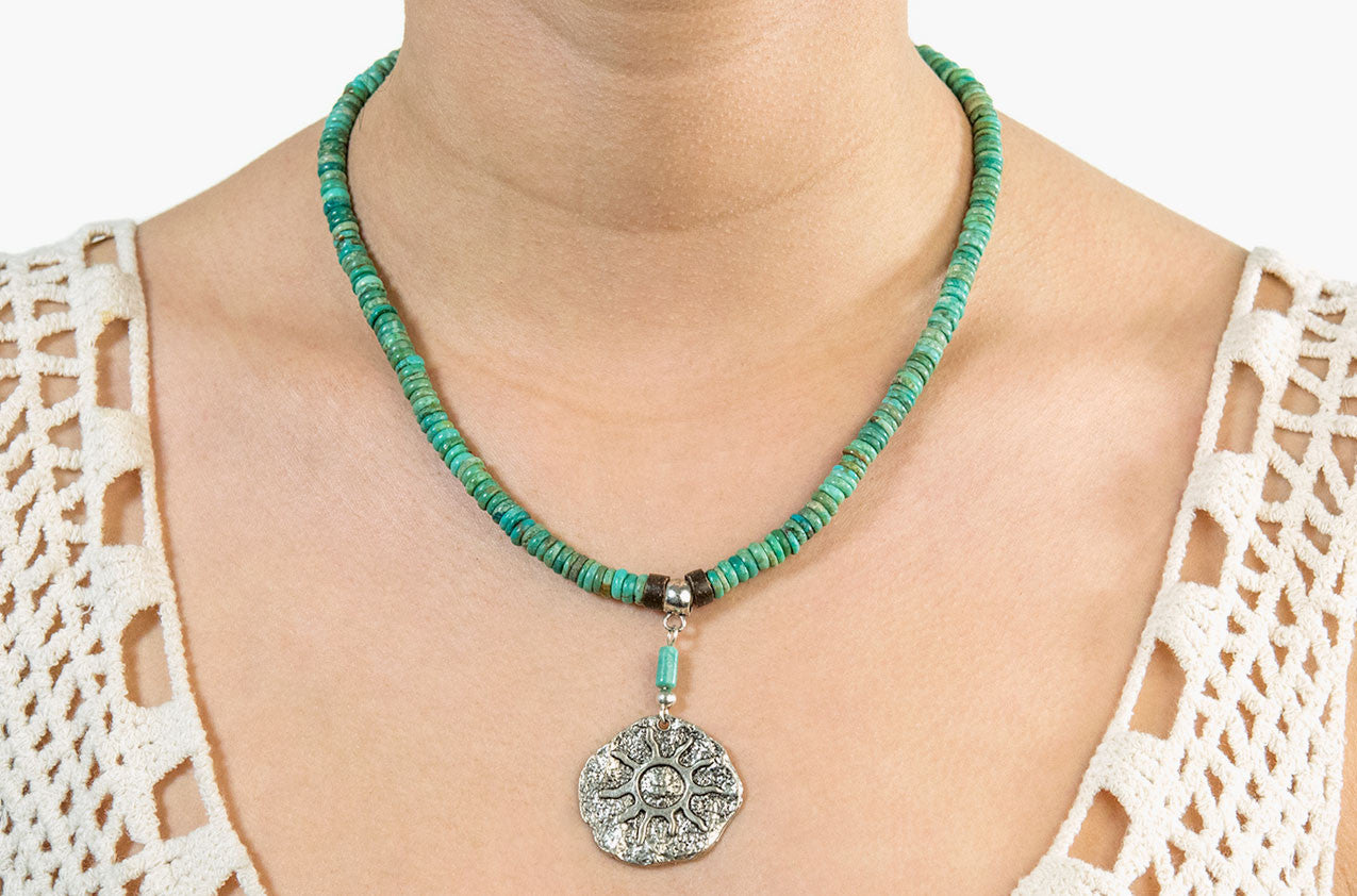Model wearing Turquoise sun medallion necklace