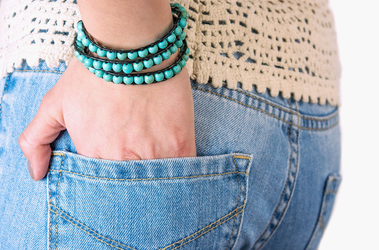 Model wearing Turquoise wrap bracelet with black leather