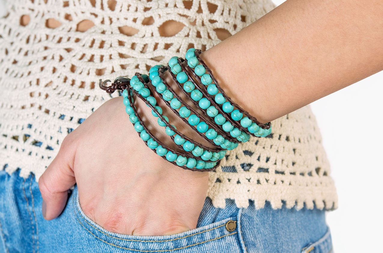 Model wearing Turquoise wrap bracelet with brown leather